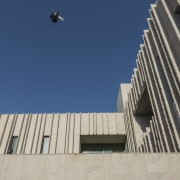 With sandstone plentiful in Ahmedabad, India, it was architecture, brutalist architecture, building, city, daytime, facade, line, reinforced concrete, sky, urban area, blue, gray