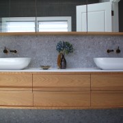 For the ensuite, pairing natural timber vanity and 