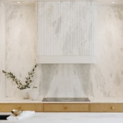 The honed Aquila marble splashback and fluted marble 