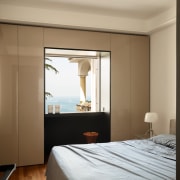 The master bedroom maintains a stylistic link to 