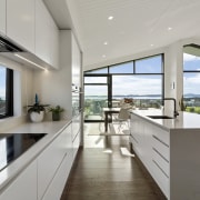 The designer kitchen includes the latest appliances and 