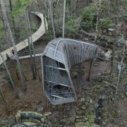 The treehouse easily bends among native pines and geological phenomenon, vehicle, gray, black