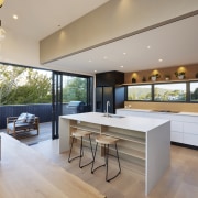 Even the kitchen splashback includes windows while downlights 