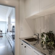 The well-appointed scullery looks out to the kitchen 