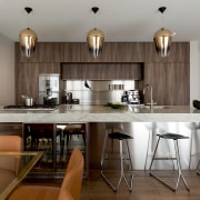 Stainless steel is a prominent surface in this bar stool, building, cabinetry, ceiling, countertop, design, dining room, floor, flooring, furniture, hardwood, home, house, interior design, kitchen, laminate flooring, light fixture, property, real estate, room, stool, table, wood, wood flooring, gray, brown