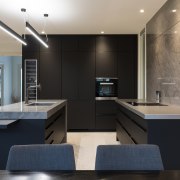 The full-height cabinetry and bar top surfaces are 