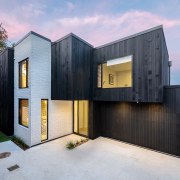 Striking two-tone cladding is part of teh home's 