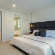 The spacious master suite bedroom with stand-out headboard 