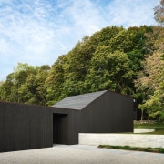 The exterior is clad in cedar processed in 