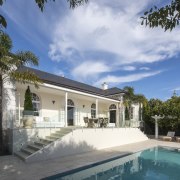 The thoughtful renovation of this large Georgian home architecture, cloud, daytime, estate, home, house, leisure, property, real estate, reflection, residential area, sky, swimming pool, villa, water, white