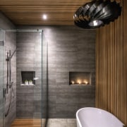 In the bathroom, the tiled areas incorporate custom architecture, bathroom, building, ceiling, floor, flooring, home, house, interior design, lighting, property, real estate, room, tile, wall, brown, gray