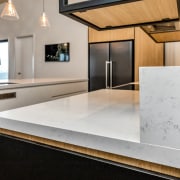 The centrally set island and rear benchtop are 