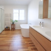 The cantilevered double vanity adds to the bathroom's 