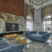 A striking bioethanol marble fireplace warms the room 