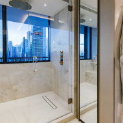 Shower stall with city views. - Automated for 