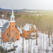 Neogothic architecture with contemporary character architecture, atmospheric phenomenon, building, chapel, church, freezing, geological phenomenon, place of worship, rural area, snow, steeple, winter, white