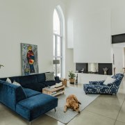 Neogothic architecture with contemporary character architecture, blue, building, ceiling, coffee table, comfort, couch, estate, floor, furniture, home, house, interior design, living room, loft, property, real estate, room, slipcover, sofa bed, table, wall, gray