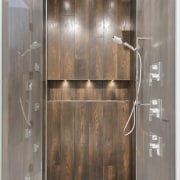 Within the custom glass stall, the shower offers 