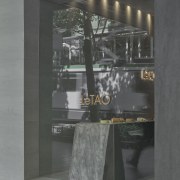 The service counter dramatically penetrates the shopfront, engaging 