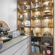 A feature wood-look wall of open shelving in 