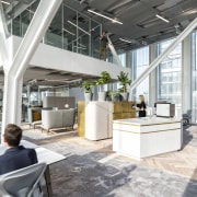 The abundance of light in the Amvest Amsterdam architecture, building, ceiling, daylighting, design, floor, flooring, furniture, home, house, interior design, living room, lobby, loft, mixed-use, office, property, real estate, room, white, gray
