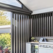 Outdoor kitchen at the rear of the home. 