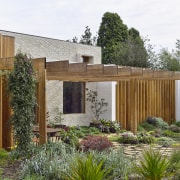 The pergola at the side of the home. 