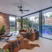 The pool house's red brickwork references the same 