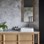 In the master suite bathroom, the distressed look 