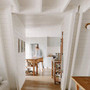 White walls and ceiling are complemented by wood 