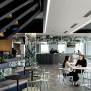 This flexible work and social space under the gray, black
