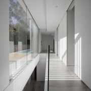 Floor to ceiling windows run the length of architecture, ceiling, daylighting, glass, handrail, house, interior design, gray