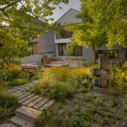 Multi-level patio with reused stone and decks cascade 