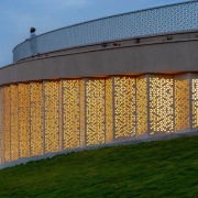 The library at dusk with its screens backlit 