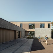 Front facade with garage at left. - Material 