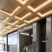 The extension's coffered wooden ceiling provides the whole 