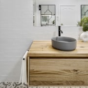 Floating the vanity and showing more uninterrupted floor 