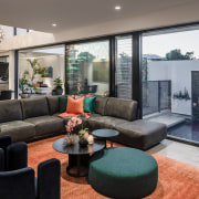 A custom rug helps organise the living area. 