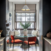 The kitchen area features a sculptural table of 