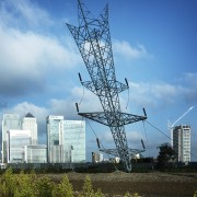 Alex Chinneck – A bullet from a shooting architecture, city, cloud, electrical supply, electricity, infrastructure, line, metropolitan area, overhead power line, public utility, residential area, sky, tower, tower block, transmission tower, tree, urban area, teal, blue