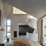 The solid-steel helix form stair connects all public 