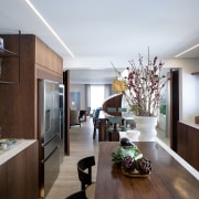 The contemporary kitchen with dining area beyond. 