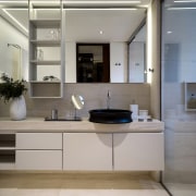 A chunky vanity top and ladder-like open shelving 
