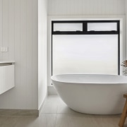 The family bathroom complete with sculptural tub and 