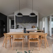 The kitchen seen from the adjacent living spaces. 
