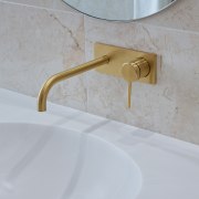 Brushed brass fittings add to the simple, yet 