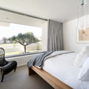 All the major openings are oriented to the apartment, architecture, bed, bed frame, bed sheet, bedding, bedroom, building, ceiling, design, floor, furniture, home, house, interior design, living room, property, real estate, room, suite, table, white