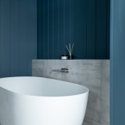 Shabby Bianco tiles feature behind the bath in 