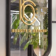 Spaceworks also designed the logo for the new door, door handle, glass, metal, mirror, window, gray