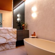 The beautifully plastered wall offers a balancing counterpoint 